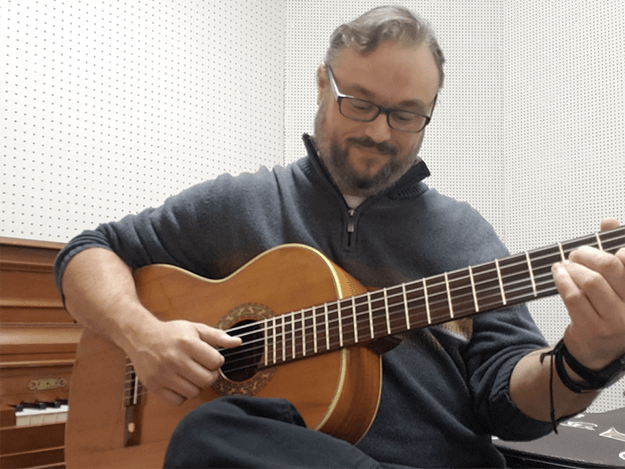 Man playing a guitar