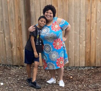 Enjoli Harris, patient scheduler for Seattle Children&rsquo;s Sickle Cell Program and &ldquo;sickle cell mom&rdquo; with her son