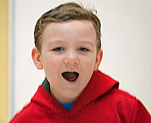 A boy in a red hoodie