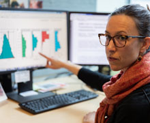 Dr. Harrington pointing at a computer screen