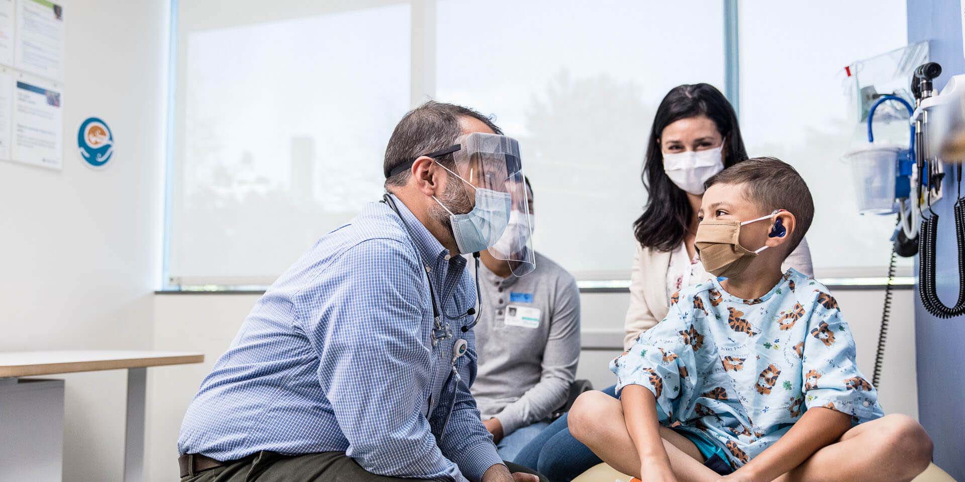 A young patient speaks to a doctor.