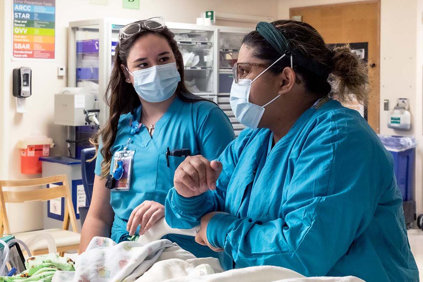 Seattle Children's nurses discuss a patient. At Seattle Children’s, our goal is to provide expert care for our patients and a healthy and safe work environment for our staff.