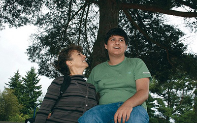 A mother and son pictured outside