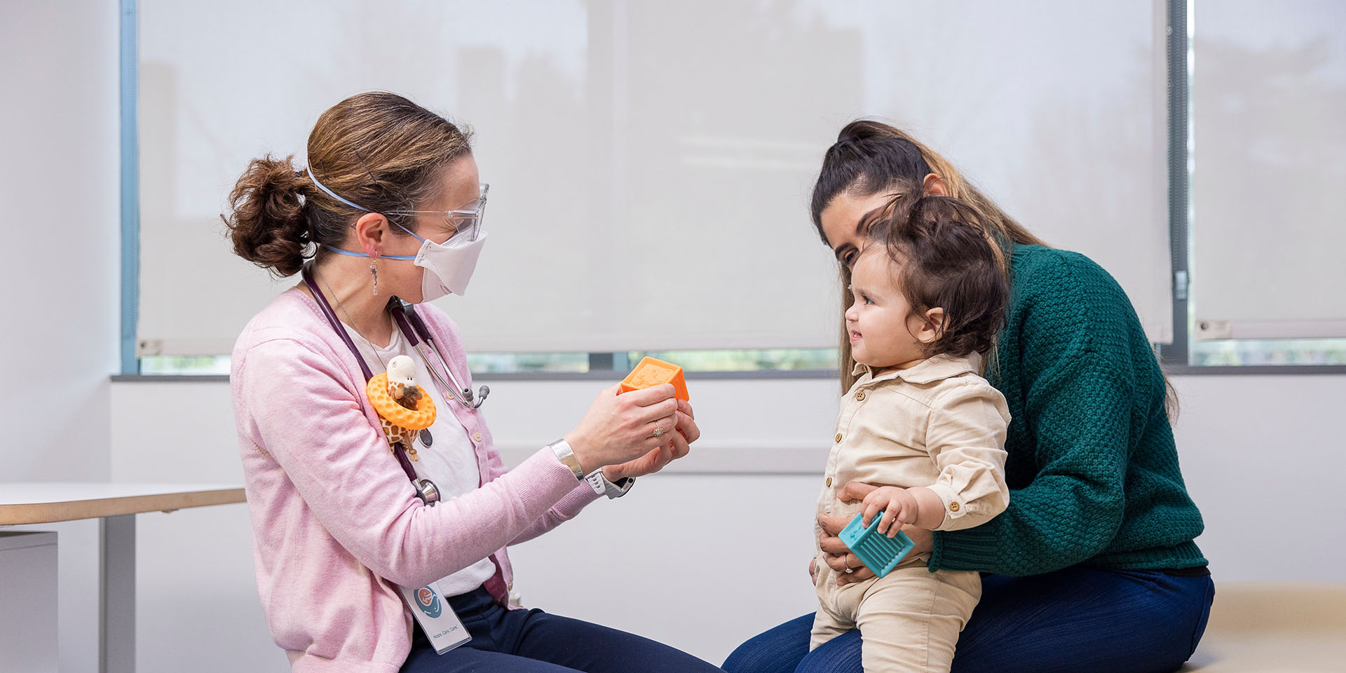 A Seattle Children's provider with a mother and daughter