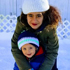 A girl and her mother in the snow