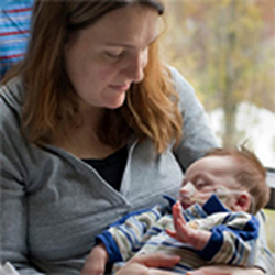 A mother holds her baby