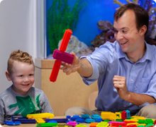 Provider playing with blocks with kiddo