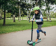 Girl on scooter with helmet