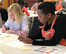 APPs painting at a table