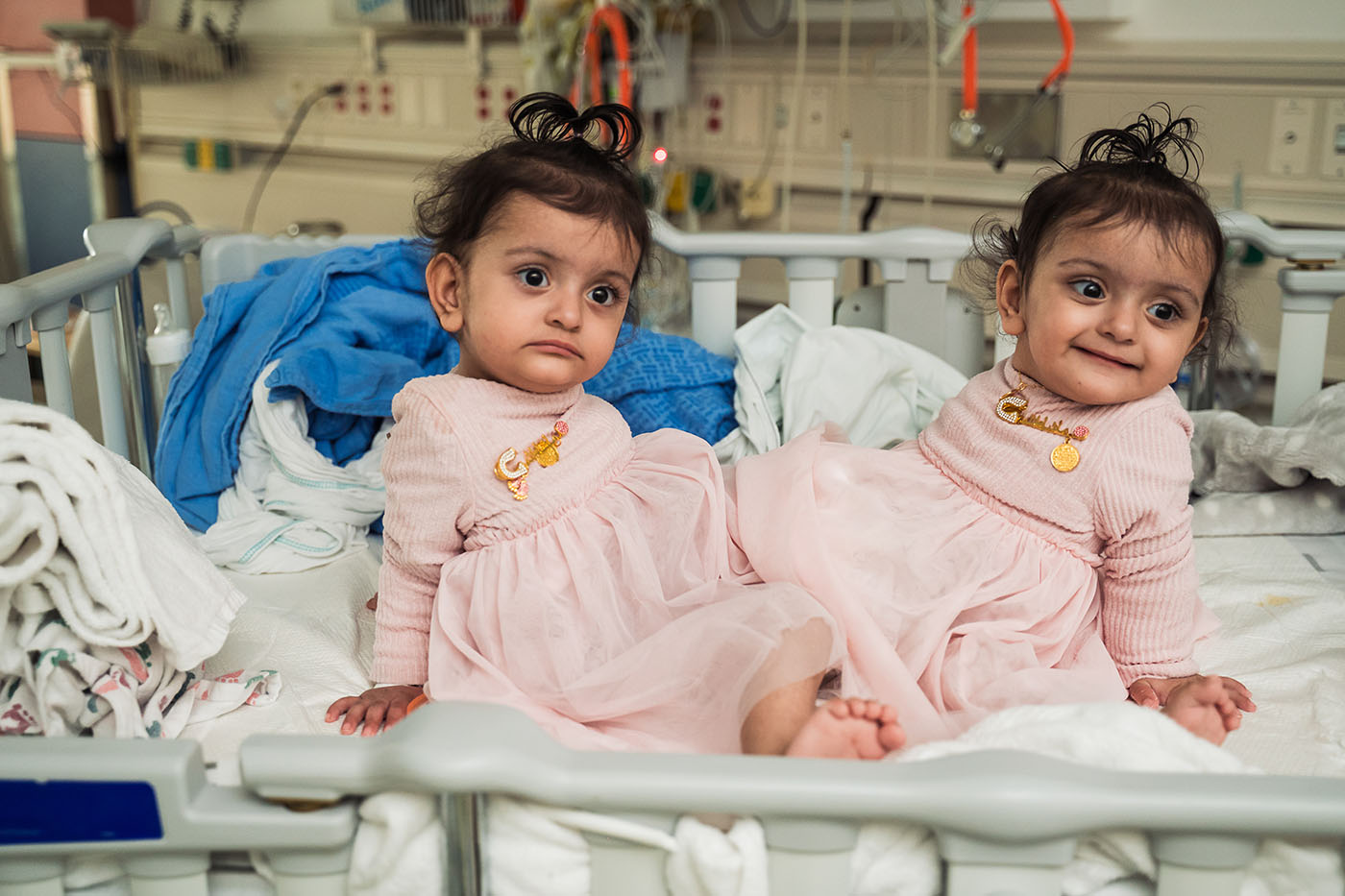 Twin girls in a hospital bed