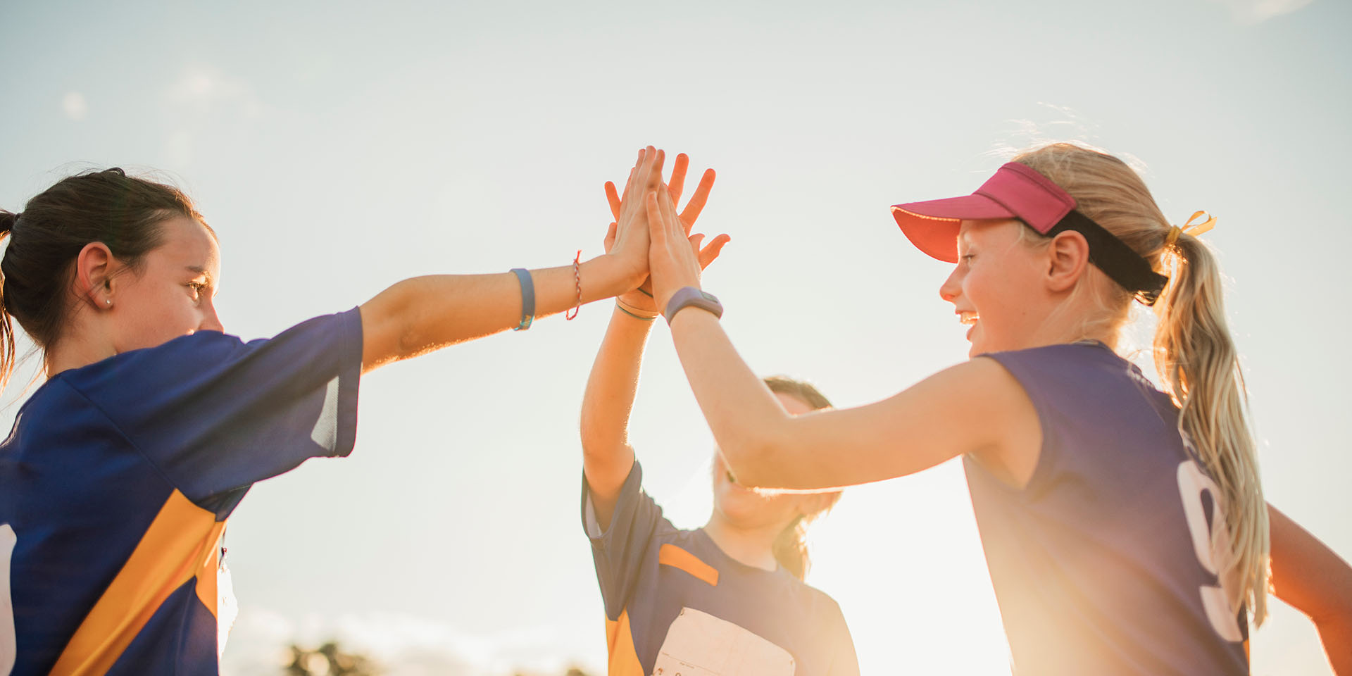 Three kids high-five
