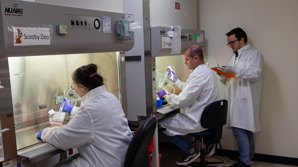 Scientist with scientific equipment