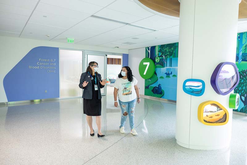 Dr. Mignon Loh speaking a patient at Seattle Children's