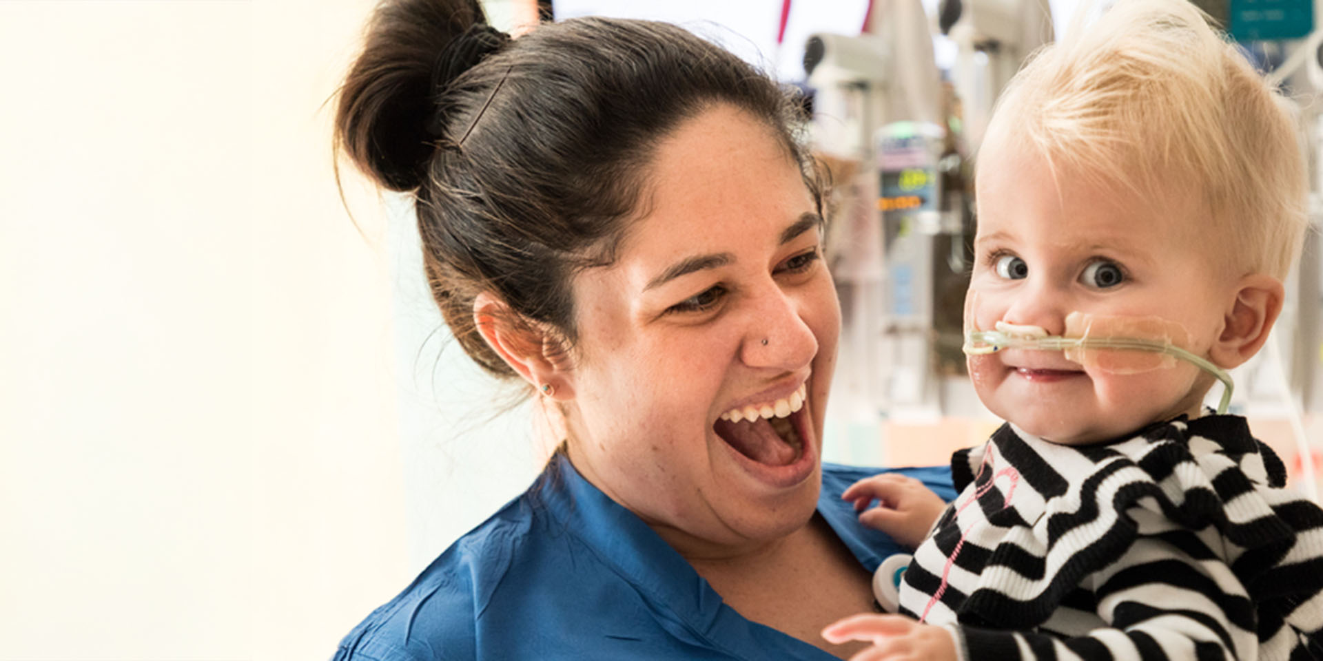 Seattle Children's nurse smiling at pediatric patient